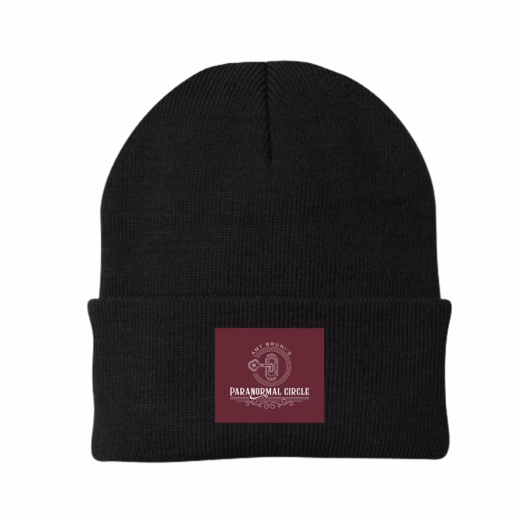Black woven beanie hat with embroidered Paranormal Circle logo badge, designed for warmth and style.