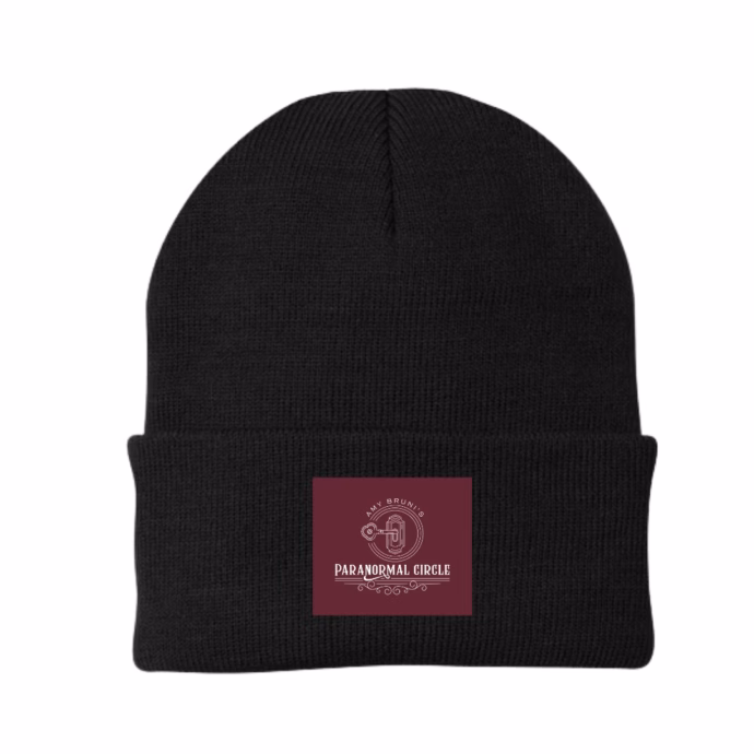 Black woven beanie hat with embroidered Paranormal Circle logo badge, designed for warmth and style.