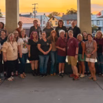 Large group photo of Paranormal Circle members and Amy Bruni outside the conference center.