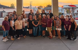 Large group photo of Paranormal Circle members and Amy Bruni outside the conference center.