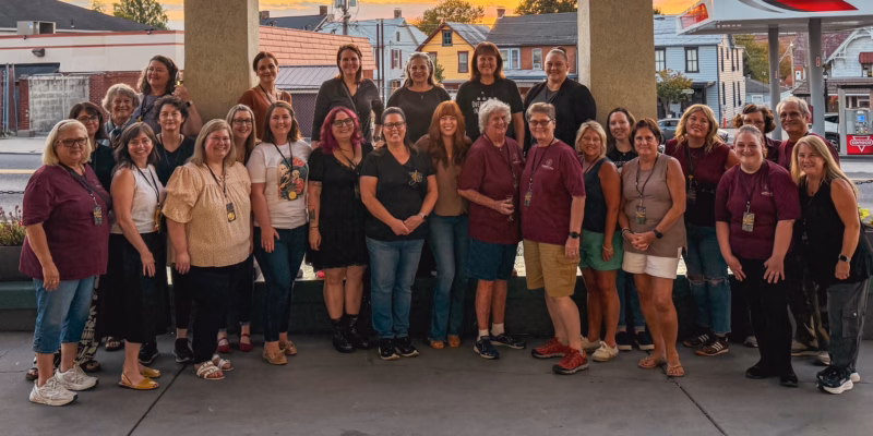 Large group photo of Paranormal Circle members and Amy Bruni outside the conference center.