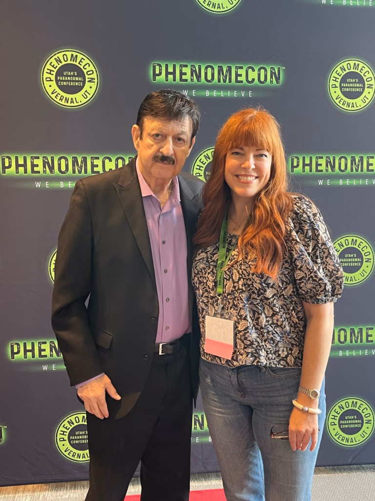 Amy Bruni poses with George Noory, host of Coast to Coast AM radio.
